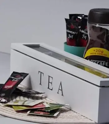 a white refrigerator with the word tea on it at Apartman MAJA in Vrnjačka Banja