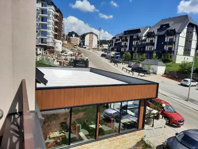 a view of a building with a parking lot at Kopaonik Bliss in Kopaonik