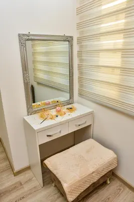 a bathroom with a mirror and a white sink at Apartmani Milenkovic in Soko Banja