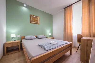 a bedroom with a bed and a window at Zoe Pirot in Pirot