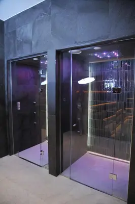 a group of glass doors in a room at Family Apart Woodside in Kopaonik