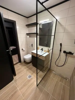 a bathroom with a shower and a sink and a toilet at MVP Apartment Kopaonik in Kopaonik