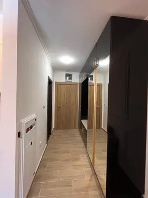 a hallway with a hallway leading into a room at MVP Apartment Kopaonik in Kopaonik