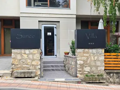 a building with two signs in front of a building at APARTMANSKI SMEŠTAJ SOLARIS kod Aqua Parka SUPERIOR & FAMILY Apartments in Soko Banja