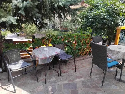 an outdoor table and chairs with a table and chairs at APARTMANSKI SMEŠTAJ SOLARIS kod Aqua Parka SUPERIOR & FAMILY Apartments in Soko Banja