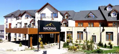 a large building with a sign in front of it at Milmari-Kopaonik in Kopaonik