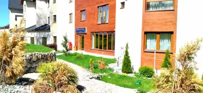 a garden in front of a building at Milmari-Kopaonik in Kopaonik