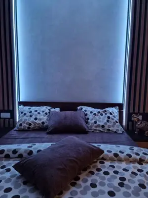 a bed with two pillows on it in a room at Rajski kutak - Centar in Kopaonik
