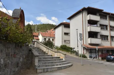 a set of stairs next to a building at Stan Na Dan Central Park in Raška