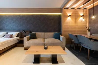 a living room with a couch and a table at Woodside Apartment 218 in Kopaonik