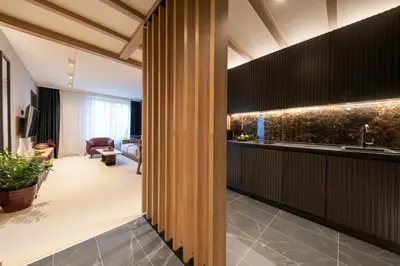 a hallway with a kitchen and a living room at Woodside Residence 325 in Kopaonik