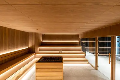 a sauna with a bench in the middle of a room at Woodside Residence 325 in Kopaonik