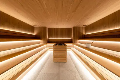 a sauna with wood paneling and a wooden ceiling at Woodside Residence 325 in Kopaonik
