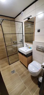 a bathroom with a toilet and a sink at BelinaKop - Kopaonik Centar in Kopaonik