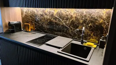 a bathroom counter with a sink and a phone at Woodside apartments Kopaonik with garage in Kopaonik