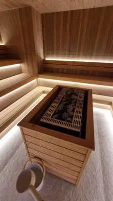 a small sauna with a woodenvisor with a wooden at Woodside apartments Kopaonik with garage in Kopaonik