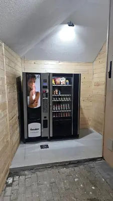 a large microwave oven in a room with a wall at Garnet Star Apartments 1 in Kopaonik