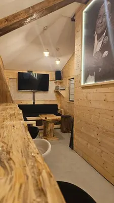 a room with a wall with a picture of a woman at Garnet Star Apartments 1 in Kopaonik
