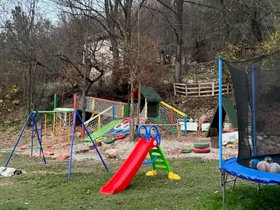 a playground with many different types of play equipment at Vila Milica Poganovo in Poganovo