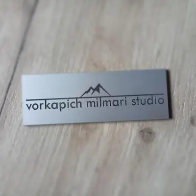 a sign for a mountain studio sitting on a table at Vorkapich Milmari Studio in Kopaonik