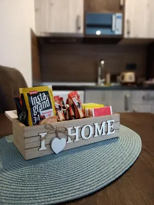 a wooden box with books and snacks on a table at Vorkapich Milmari Studio in Kopaonik