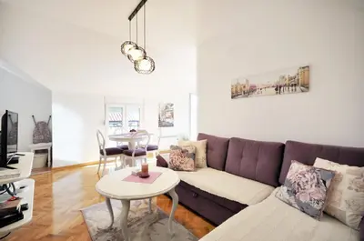 a living room with a couch and a table at Apartman Provansa in Vrnjačka Banja