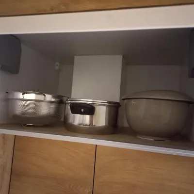 two pots and pans sitting on top of a kitchen counter at Garnet Star Apartments, Kopaonik, apartman br 2 in Kopaonik