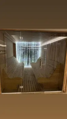 a view through a glass window of a train station at Apartman N98 Milmari Kopaonik in Kopaonik