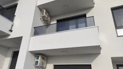 an external view of a building with a balcony at LaNe apartman Sokobanja in Soko Banja