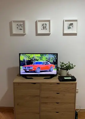a flat screen tv sitting on top of a dresser at Apartman Kosta in Leskovac