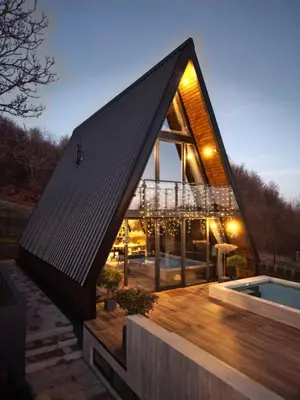 a house with a black roof and a pool at V house Goc in Miodragoviči