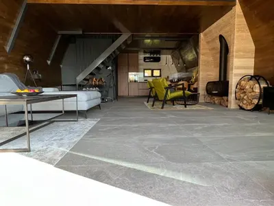 a living room with a couch and a table at V house Goc in Miodragoviči