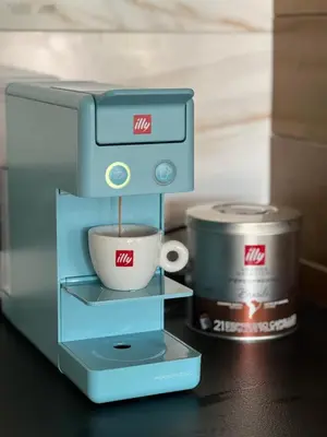 a coffee maker with a cup on a table at V house Goc in Miodragoviči