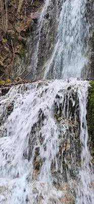a waterfall on the side of a mountain at Stefanović - Studio 1 in Inovo