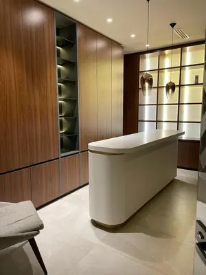 a kitchen with a tub and a wine cellar at Apartman Kopaonik Woodside 106 in Kopaonik