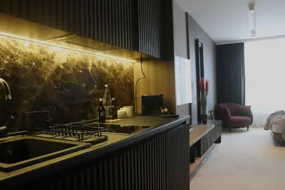 a kitchen with a sink and a counter top at Superior Woodside Residences & Spa Kopaonik in Kopaonik