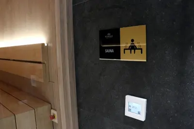 a room with a picture of a person sitting at a table at Superior Woodside Residences & Spa Kopaonik in Kopaonik