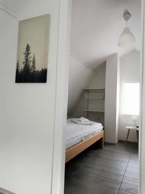 a bedroom with a bed and a picture on the wall at Kod Dede Brzece in Brzeće