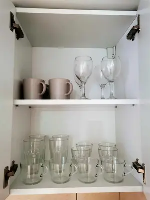 a row of glass wine glasses on a shelf at Kod Dede Brzece in Brzeće