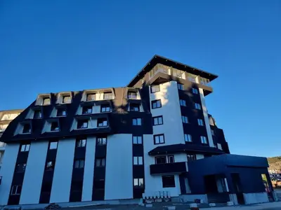 a building with black and white at Xenon Apartments in Kopaonik
