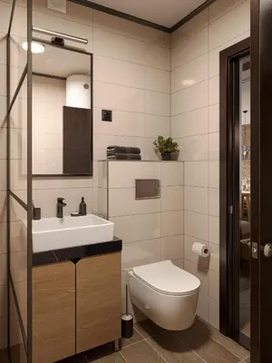 a bathroom with a toilet and a sink and a mirror at Xenon Apartments in Kopaonik