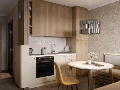 a kitchen with a table and a dining room at Xenon Apartments in Kopaonik