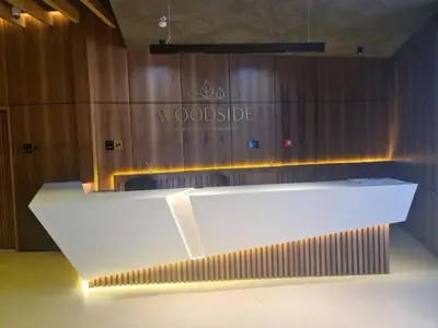 a white counter in front of a wooden wall at Woodside Kopaonik 416 in Kopaonik