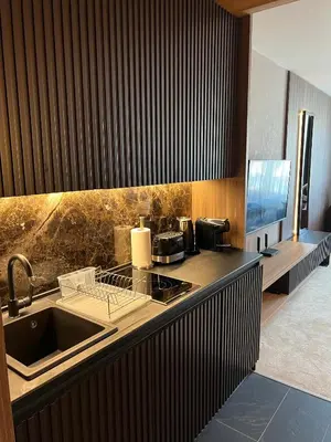 a kitchen with a sink and a counter top at Woodside Kopaonik 416 in Kopaonik