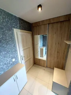 an empty kitchen with a door and a window at VS Apartman , Hotel Župa Kopaonik in Kopaonik