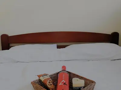 a bed with a basket of food on it at Apartman Snezanka Kopaonik in Kopaonik