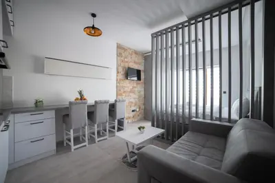 a living room with a couch and a table at NLux 10 Apartment in Kopaonik