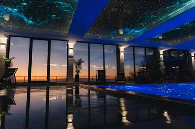 a starry sky over a swimming pool at night at NLux 10 Apartment in Kopaonik