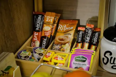 a drawer filled with different types of snacks at Apartman Marić Raj in Vrnjačka Banja