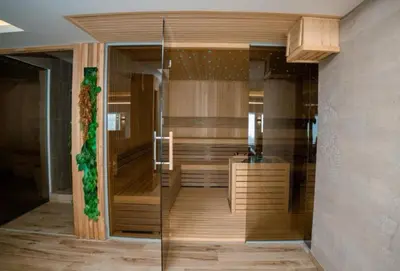 a bathroom with a shower and a bath tub at Apartman Laura in Kopaonik